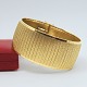 Wide bracelet in 18k gold Wide bracelet in 18k gold